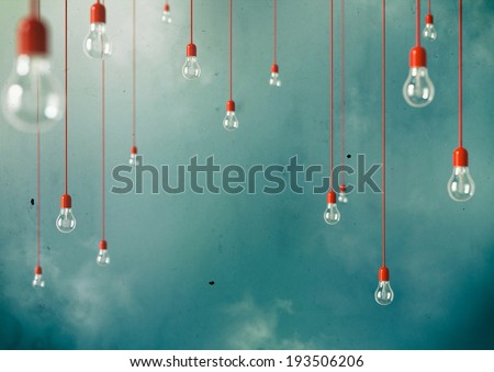 Photo of Hanging light bulbs with depth of field. Modern art