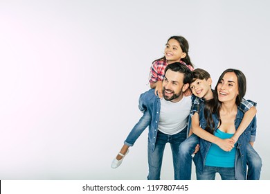 Photo Of Happy Beautiful Family Isolated On White And Looking Away