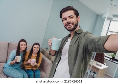 Photo of happy cheerful programmers company recording video drinking tea indoors workstation workshop - Powered by Shutterstock