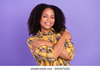 Photo Of Happy Comforted Dark Skin Young Woman Hug Herself Good Mood Isolated On Purple Color Background