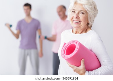 Photo Of Happy Elderly Woman At Gym After Training