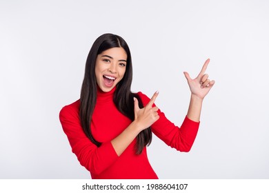 Photo of happy excited cheerful young asian woman point fingers copyspace advertisement isolated on grey color background