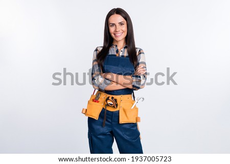 Photo of happy lovely smiling good mood woman builder handyman with folded hands isolated on white color background Foto d'archivio © 