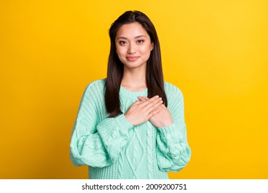 Photo Of Happy Nice Charming Woman Hold Hands Heart Honest Smile Isolated On Yellow Color Background