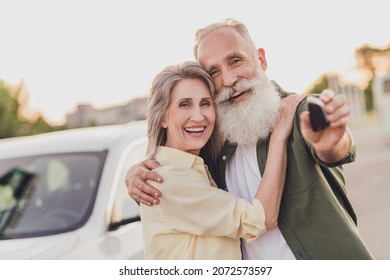 Photo Of Happy Retired Wife Husband Pensioner Old People Hug Hold Hand Car Sale Keys Smile Outside Outdoors In City