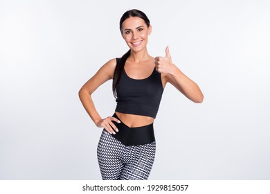 Photo of happy smiling beautiful sportive athlete woman showing thumb-up like isolated on white color background - Powered by Shutterstock