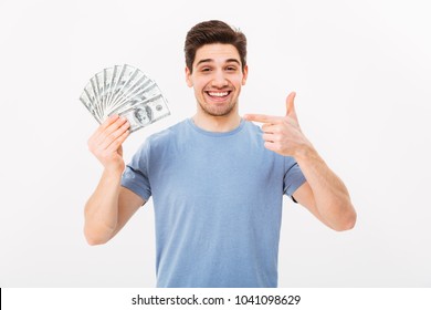 Picture Of Casual Happy Man Holding Money