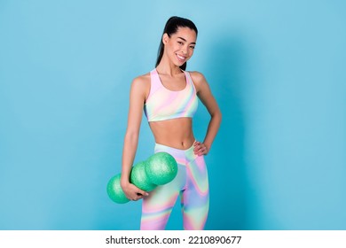 Photo Of Healthy Lady Hold Fitness Tool Massage Roll Wear Rainbow Print Leggings Pants Isolated Blue Color Background