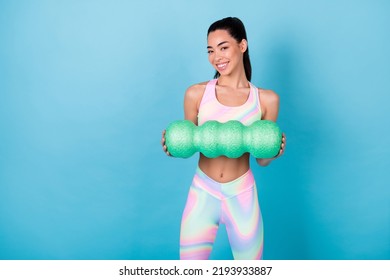 Photo Of Healthy Lady Hold Massage Roll Doing Crossfit Wear Rainbow Print Top Leggings Isolated Blue Color Background