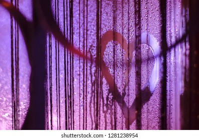 Photo of the heart on the misted window with light highlights. Art photo. Valentine day concept - Shutterstock ID 1281238954