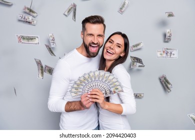 Photo Of Hooray Young Brunet Couple Win Money Wear White Shirt Isolated On Grey Background