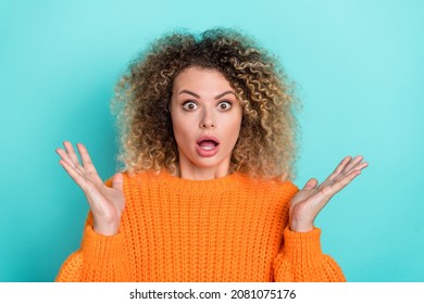 Photo Of Horrified Lady Open Mouth Staring Camera Confused Face Wear Orange Knitted Sweater Isolated Teal Color Background