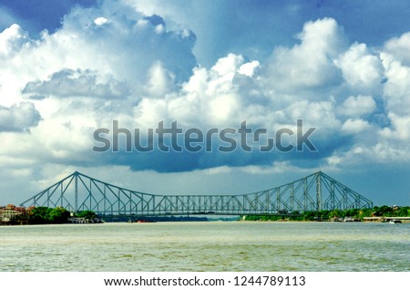 A photo of Howrah bridge located in Kolkata on river ganga mainly known asHoogly river , india.