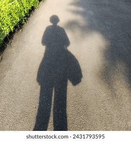 Photo of human shadow throughout the body during the day