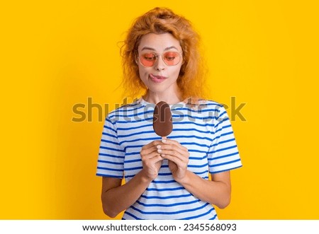 photo of hungry girl with icelolly ice cream at summer. girl with icelolly ice cream