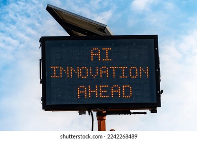 Photo illustration of digital road sign in front of blue sky with text AI Innovation Ahead to convey a concept of innovation in the field of artificial intelligence. - Shutterstock ID 2242268489