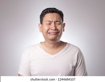 Photo Image Of Funny Asian Man Crying Close His Eyes, Sad Depression Frustration Hopeless Expression