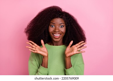 Photo Of Impressed Big Hairdo Brunette Lady Hands Up Wear Green Sweatshirt Isolated On Pink Color Background