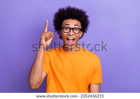 Photo of impressed cheerful clever person point finger open mouth brilliant idea isolated on violet color background