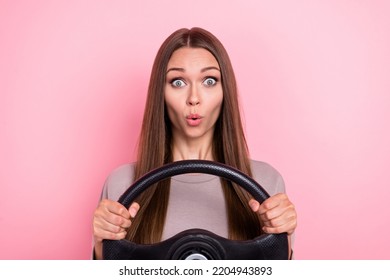 Photo Of Impressed Girl Arms Hold Steering Wheel Pouted Lips Unbelievable Isolated On Pink Color Background