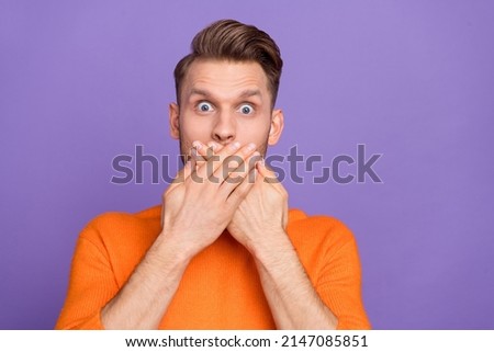 Photo of impressed man in knitted pullover sorry to say many bad words feel guilty isolated on violet color background