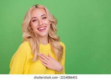 Photo of impressed millennial blond lady hand heart wear yellow pullover isolated on green color background - Shutterstock ID 2214086451
