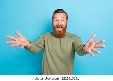 Photo Of Impressed Overjoyed Guy With Ginger Hairdo Dressed Khaki Long Sleeve Open Mouth Glad To See You Isolated On Blue Color Background