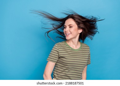 Photo of impressed young brunette lady look promo wear green t-shirt isolated on blue background - Shutterstock ID 2188187501