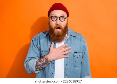 Photo of impressed young guy after listening incredible unbelievable news isolated on bright color background