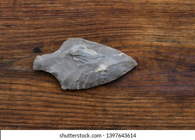 Photo of an Indian Arrowhead on a wooden background