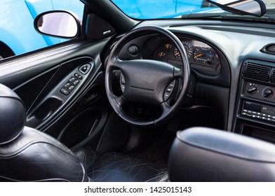 Photo of the interior of the car. The car is a convertible. Steering wheel, dashboard. American classic, muscle car - Shutterstock ID 1425015143