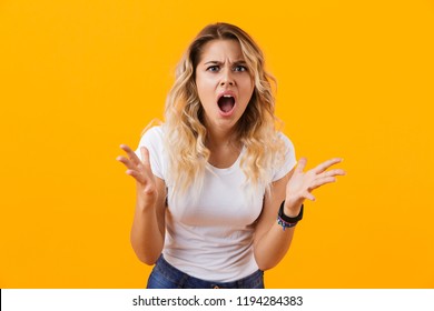 Photo Of Irritated Woman In Casual Clothes Shouting In Anger Isolated Over Yellow Background