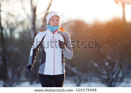 Photo of jogging young athlete