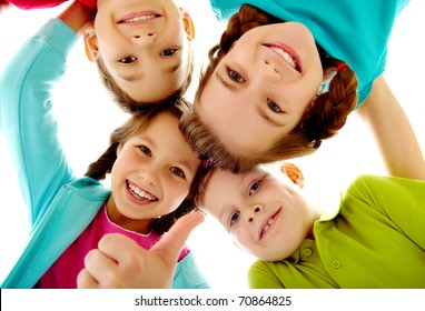 Photo of joyful children touching by their heads with girl her thumb up - Powered by Shutterstock