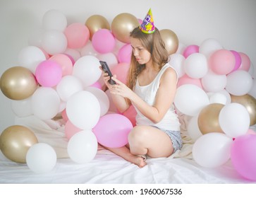 Photo Of Joyful Woman Smiling And Taking Selfie Photo On Cellphone  With Balloon. Birthday Party