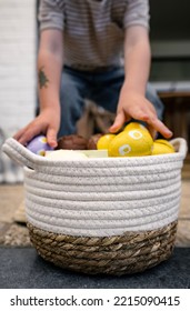 Photo Of Kid Collecting Chocolate Easter Eggs In Basket