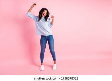 Photo Of Lady Dance Raise Hands Open Mouth Space Wear Blue Pullover Jeans Shoes Isolated Pink Background