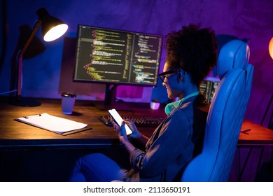 Photo of lady freelancer sit desk use gadget screen texting client operating system support in evening late workplace workstation