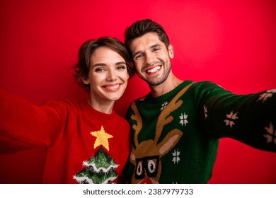 Photo of lady guy have fun on christmas event recording video selfie portrait isolated bright color background - Powered by Shutterstock