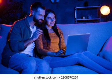 Photo Of Lady Guy Sit Cozy Couch Use Netbook E-commerce Apps Read Notification In Evening Dark Apartment