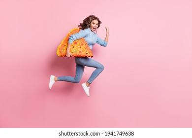 Photo Of Lady Jump Run Fast Open Mouth Hold Pizza Slice Pinata Wear Blue Pullover Jeans Footwear Isolated Pink Background