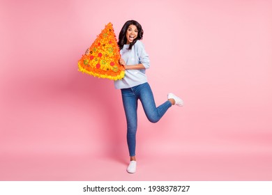 Photo Of Lady Stand One Leg Hold Pizza Slice Pinata Open Mouth Wear Blue Sweater Jeans Shoes Isolated Pink Background