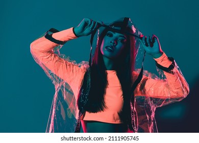 Photo of lady weekend futuristic theme party festival rubber raincoat isolated gradient vibrant color background