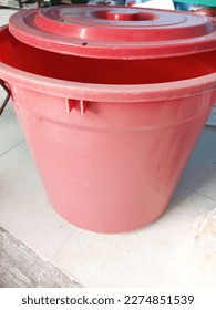 Photo of a large red plastic bucket, taken at close range - Shutterstock ID 2274851539
