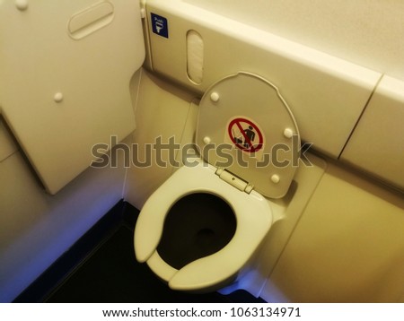 Photo of a lavatory in commercial airplane. Aircraft Toilets.