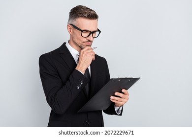 Photo of leader ceo qualified guy hold clip board check applicant resume cv isolated over grey color background - Powered by Shutterstock