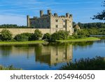 A photo of Leeds Castle in Maidstone England reflecting in water