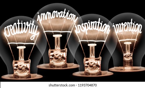 Photo of light bulbs with shining fibers in CREATIVITY, INNOVATION, INSPIRATION, INVENTION shape isolated on black background; concept of IDEA - Shutterstock ID 1193704870