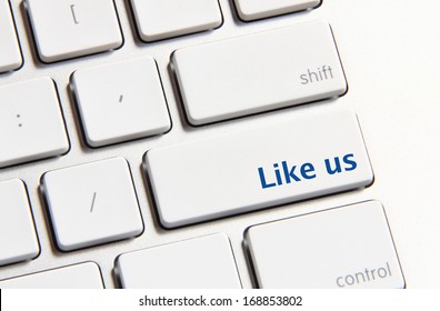 Photo of like us button on the white keyboard.