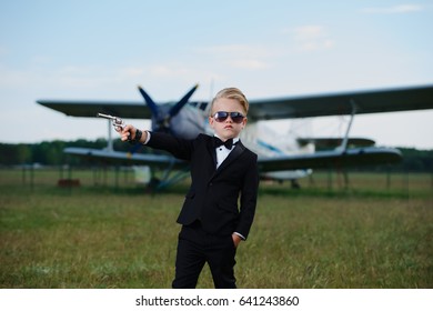 Photo Of Little Boy Playing Secret Agent